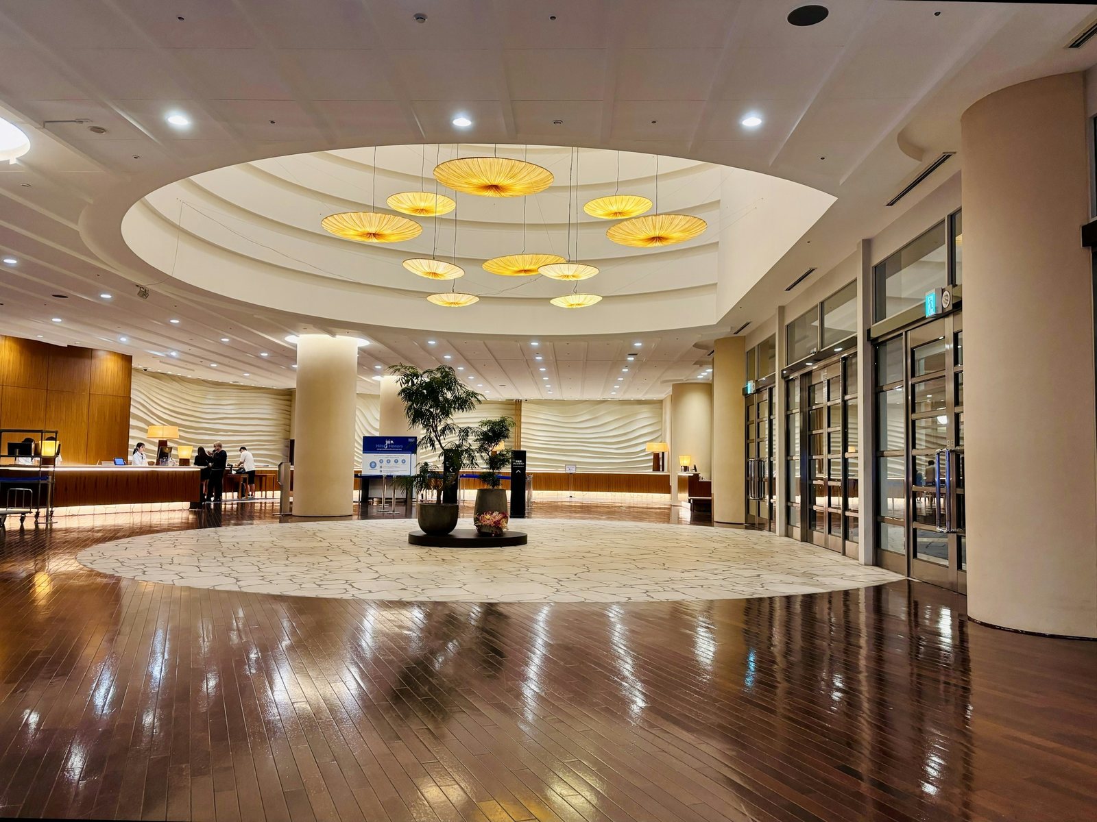 Hotel lobby, reception desk and entry doors — the public areas a hospitality cleaning contract covers