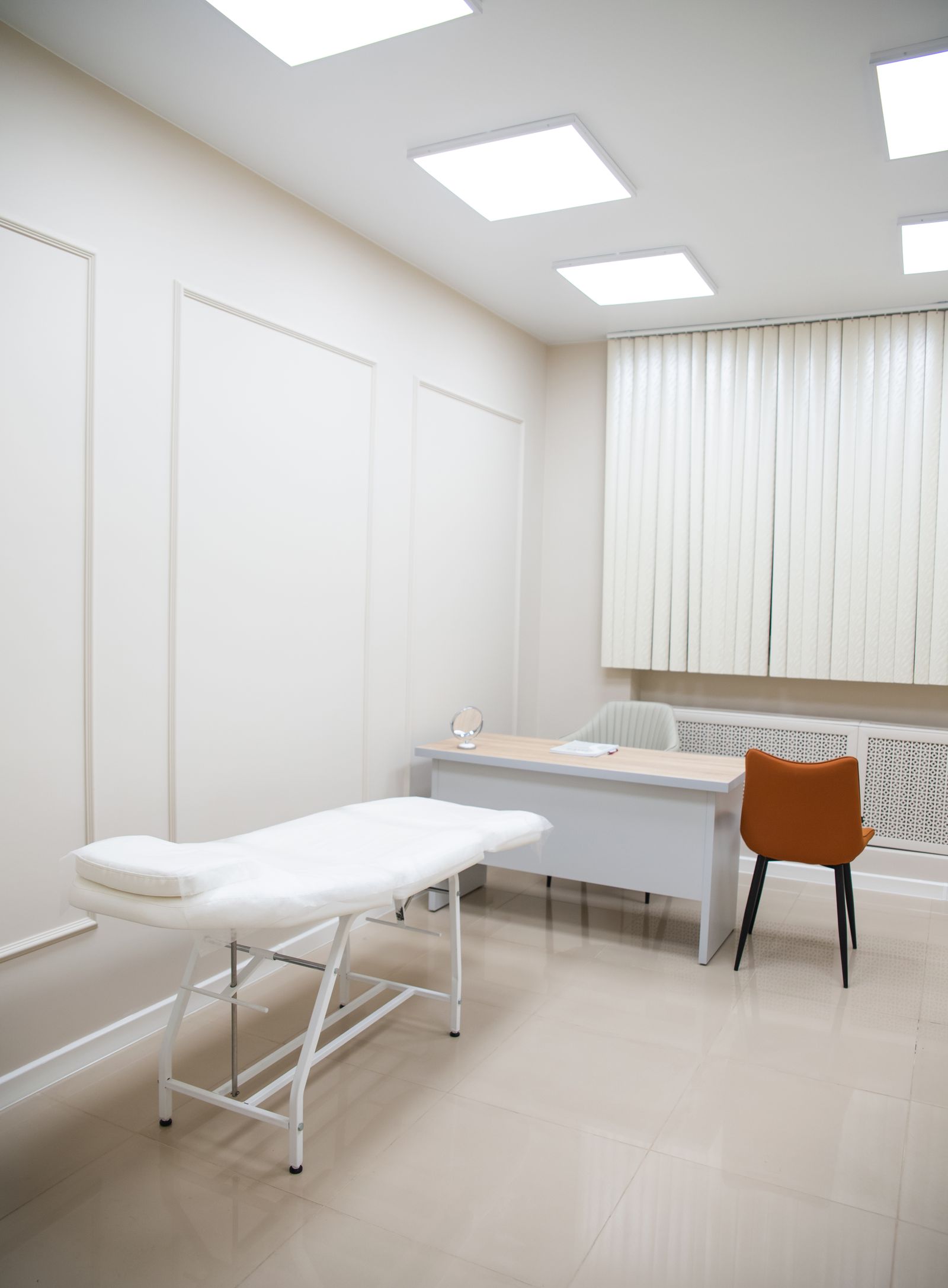 Clean medical exam room maintained to clinical standard